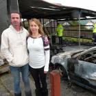 Balclutha couple Glenn Burns and Giselle Cooper take stock of the damage after a fire destroyed...