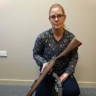 Detective Sergeant Hannah Booth, of Oamaru, with two firearms recently seized as a result of the...