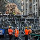 Contractors erect scaffolding on Brecon St yesterday in preparation for tonight's evening's Rail...