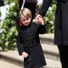 Prince George on the steps of St George's Chapel in Windsor Castle after the wedding of Prince...