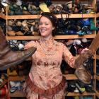 Actress Nadya Shaw Bennett displays items from the Fortune Theatre's wardrobe that have been...