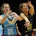 Steel goal shoot Jennifer O’Connell (left) secures the ball ahead of Magic goal defence Katherine...