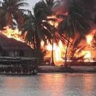 The Aitutaki Lagoon Resort &amp; Spa up in flames. Photo: Annita Cyprien Drollet via NZ Herald