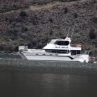The Wanaka-based cruise boat Dual Image is used as part of the search for helicopter pilot Matt...