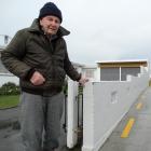  Gordon Johnson says a fence between his property and the Caltex station on  Thames Highway was...