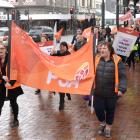 Dunedin PSA members move through the Octagon yesterday during a march in support of better pay....