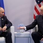 US President Donald Trump (right) meets with Russian President Vladimir Putin during their...
