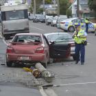 Police attend the scene of a crash in Victoria Rd yesterday afternoon, where a vehicle knocked...
