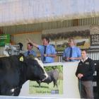 PGG Wrightson livestock genetics rep Callum McDonald (left), auctioneer John McKone (centre) and...