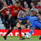 Manchester United’s Matteo Darmian (left) tries to evade the challenge of Leicester City’s...