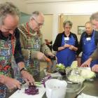 Senior chefs chop and grate vegetables for coleslaw. At rear are Pip Weber and  Craig McLanachan....