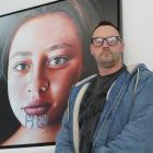 Invercargill artist Greg McDonald with his painting Descendant X, the subject of which will come...