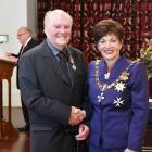 Greame Robertson receives the Queen's Service Medal from Govenor-General Dame Patsy Reddy in 2016...