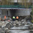 Police investigate a building site in the Water of Leith yesterday. Photo: Gregor Richardson