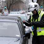 Parking officers will wear cameras and a badge from Tuesday. Photo: ODT