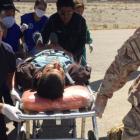 A person is transported to a helicopter after eating contaminated food at a funeral in the...