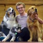 University of Otago student Finnbar Grieve (19) chills with friendly dogs (from left) Martin, ...