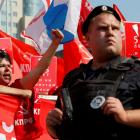 A man shouts slogans during a protest against a proposed increase of the retirement age in Moscow...