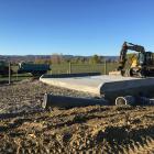 Heavy machinery sits on the construction site of the Otago Regional Council's latest stock truck...
