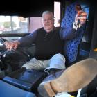 Go Bus Dunedin depot manager Colin Abbis (64) hands back the keys yesterday after 43 years in the...