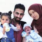 Syrian refugee family (from left) Lamis (1, left) Mohammad, Adam (2 months) and Khlud Saadaldeen...