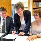 Goethe Institut national German adviser Heike Papenthin signs a scholarship agreement with John...