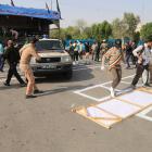 Iranian security forces take security measures after an armed attack targeting a military march...