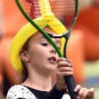 A determined Olivia Harwood keeps her eyes set on a pair of airborne tennis balls during the...