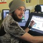 Game developer Nik Bartlett (20) works on his endless-runner game Supreme Mech Panda for the...