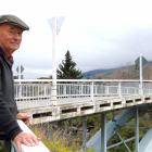 Teviot Valley resident John Rowley stands by the Jedburgh bridge across the Clutha River, at...