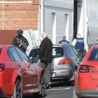 Police surround a warehouse in South Dunedin. Photo: Gerard O'Brien