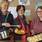 The Hub free meals team (from left) Pip Gardyne, Heather Gullick and Sarah Cowan dish up a hot...
