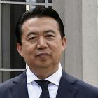Interpol President Meng Hongwei poses during a visit to the headquarters of International Police...