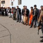 Afghan men line up to vote in Kabul, Afghanistan. Photo: Reuters