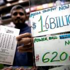 A newsstand vendor displays tickets for the Mega Millions lottery drawing in the USA. Photo: Reuters
