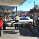 A car crashed into a fence coming to a stop outside a record store in South Dunedin this morning. Screengrab: ODT