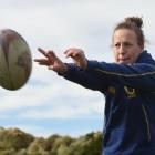 Looking ahead ... Otago Spirit openside flanker Georgia Mason (20)  helps out at a girls’ under...
