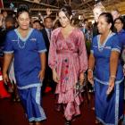 Meghan, Duchess of Sussex, walks with locals during a visit to a market in Suva, Fiji. Photo:...