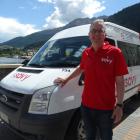 Go Bus director Russell Turnbull with a Savy ride-share minibus in Queenstown last November....