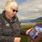 Janet Rutherford with a photo of her late husband, Robert, at her Frankton home yesterday. PHOTO:...