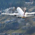 A Virgin Australia aircraft leaves Queenstown Airport over Frankton. Photo: Stephen Jaquiery