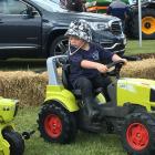 Jaxon Dole (3), of Ashburton, takes the Claas Arion for a test drive at the Ashburton A&amp;P...