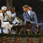 Britain’s Prince Harry and Meghan, the Duchess of Sussex attend an official welcome ceremony in...