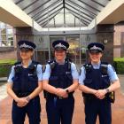 Taking a break from work outside the Dunedin central police station on Tuesday are (from left)...