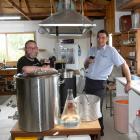 Mosgiel brewers Brett Houliston and Jimmy Henderson raise their prize-winning brew. PHOTO: LINDA...