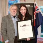 Alexandra poet Michael Harlow is congratulated by Prime Minister Jacinda Ardern on receiving the...