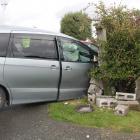 A car ploughed through a fence after colliding with another vehicle in Invercargill this morning....