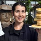 Jimmy's Pies shop assistant Meghan Scanlan with a mince and cheese pie (left), and a stack of...