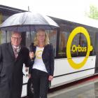 Orbus driver Stephen Poole watches as Queenstown Lakes Mayor Jim Boult and Otago Regional Council...