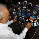 Taiwanese Chen San-yuan, known as "Pokemon grandpa", plays the mobile game "Pokemon Go" by...